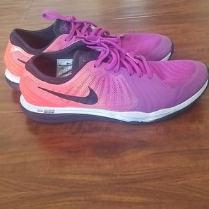 Purple and orange Nike shoes